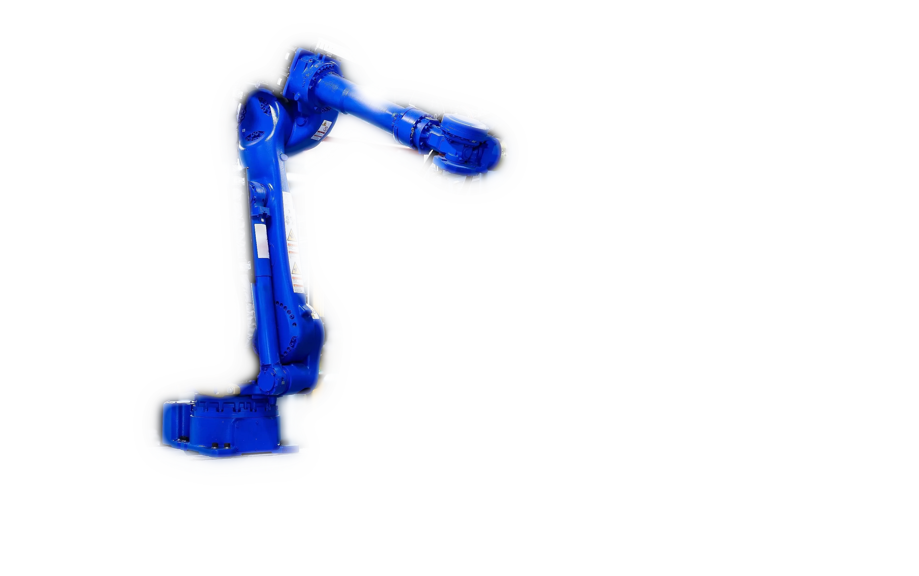 Ein Industrieroboter in einer Fertigungszelle, im Halbdunkel aufgenommen: die Maschine, an der MINERVA misst.